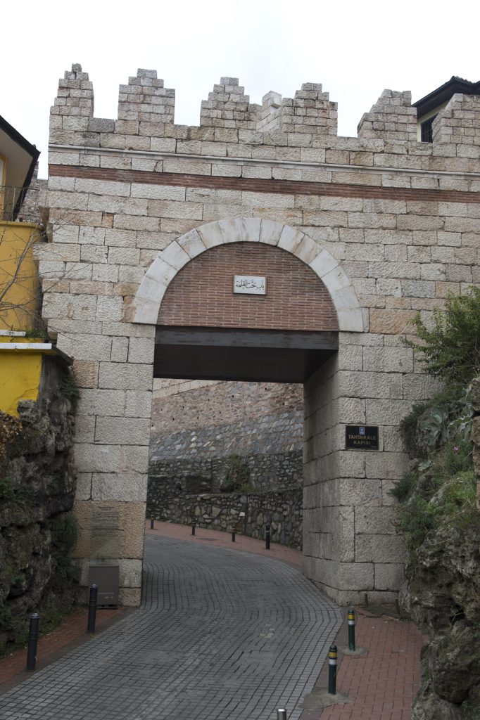Tahtakale Gate of Bursa Citadel featuring historic stone walls and a fortified arched entrance