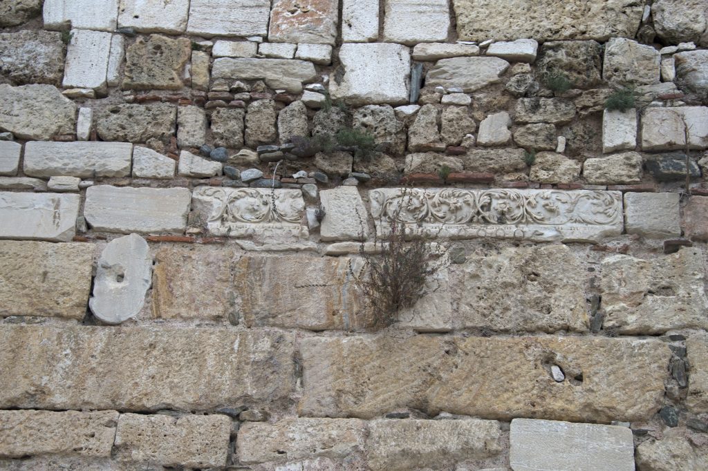 Reused ancient carved stone blocks in the historic walls of Bursa Citadel at Yer Kapı
